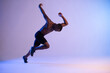 © Cavan Images - Active black male athlete running in studio