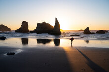 Sun Setting Behind Sea Stacks On The Oregon Coast