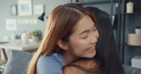 Sticker - Happy Asian women teenager visit her close friends cuddling smiling at home. Overjoyed excited best buddies embracing hugging, greeting each other with success, true strong friendship concept.