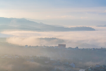 Wall Mural - the small village brighten in the foot mountains at dawn