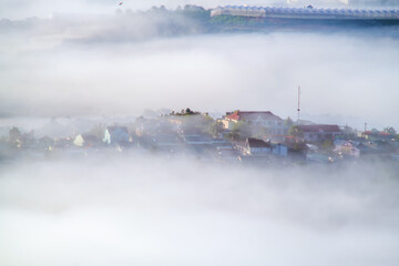 Wall Mural - the small village brighten in the foot mountains at dawn