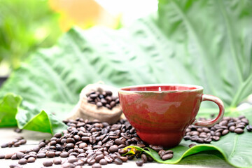 Poster - Hot coffee with coffee beans in the morning on wood table background and space for text, americano coffee 