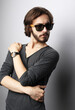 © Raisa Kanareva - Portrait of a young handsome man wearing sunglasses