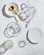 High angle view of glassware for tea shade on white table on sunny day
