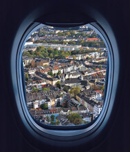Looking Through The Airliner Window Out. Beautiful Scenic Overhead Airplane View Of Dusseldorf City. Flying Over The Northern Rhine Westphalia, Germany