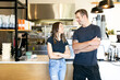 © Austockphoto - horizontal shot of a man and a woman both looking at each other with arms crossed on chest