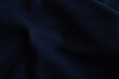 Dark blue textile background. Surface of navy fabric texture. 