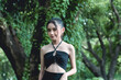 A young asian woman confidently flaunts her small skinny and lithe frame and narrow shoulders. beautiful girl with an ectomorphic body.