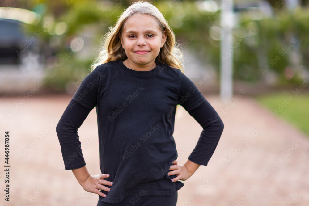 young girl dressed in black standing with hands on hips Stock Photo ...