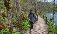 Woman Exploring The Plitvice Lakes National Park