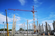 Construction site with cranes, complex work is underway to install an apartment building by the company BK: G. Kostanay / Kazakhstan - June 26, 2021