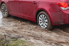 Car Stuck In The Mud, Car Wheel In Dirty Puddle, Rough Terrain