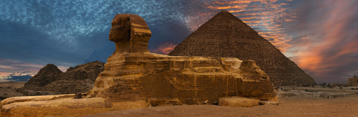 Wall Mural - Sphinx against the backdrop of the great Egyptian pyramids. Africa, Giza Plateau.