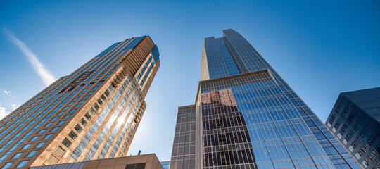 Denver city skyline with blue sky, view from the street, Colorado - USA.