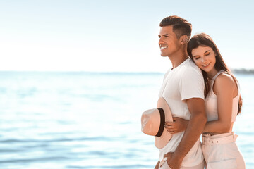 Sticker - Happy young couple on sea beach