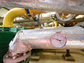 Manometers and valves with heating pipelines in boiler room