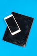 © Elena - Tablet laptop and mobile phone with broken and dirty screen glass. Result of falling or crash, bad condition of devices. Vibrant blue background, copy space.