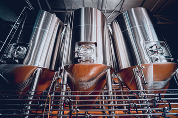 Rows of steel tanks for beer fermentation and maturation in a craft brewery