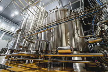 Rows of steel tanks for beer fermentation and maturation in a craft brewery