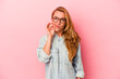 © Asier - Caucasian blonde woman isolated on pink background with fingers on lips keeping a secret.