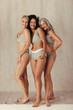 © Jacob Lund - Full length shot of diverse women posing in their natural bodies