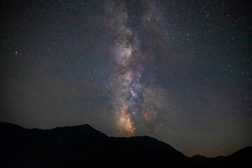 Wall Mural - milky way over mountains in summer