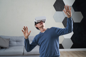 Wall Mural - man is using virtual reality headset. concept of virtual reality, gaming and future technology.