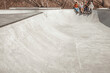 © Marharyta Hanhalo - A group of teenagers prepare for skating in a skatepark, sit on a ramp in a skatepark and discuss what motivates them to better results