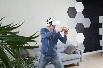 Wall Mural - man with virtual reality headset is playing game.