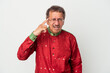 © Asier - Senior indian man wearing a Indian costume isolated on white background showing a disappointment gesture with forefinger.