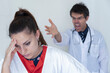 © fabio - Doctor screams and yells at the poor scared and disconsolate nurse. Concept of bullying on nurses in healthcare.