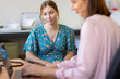 © Austockphoto - young female at medical appointment in doctors surgery
