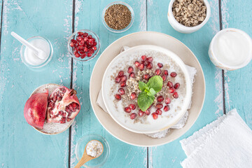 Wall Mural - Close-up of a bowl of millet semolina with pomegranate seeds