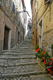 Fototapeta Uliczki - An alley in the medieval quarter of Maenza, a medieval town in the Lazio region. Italy.