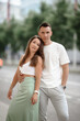 © lialia699 - Young man and woman in love outdoor posing in summer city, proposal concept
