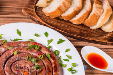 Wall Mural - sausage portion with wood and brick background