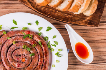 Wall Mural - sausage portion with wood and brick background