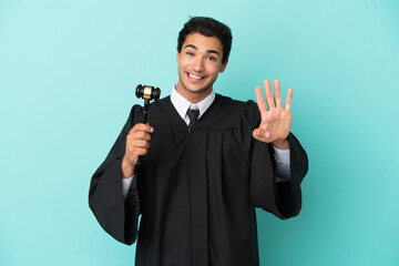 Wall Mural - Judge over isolated blue background happy and counting four with fingers