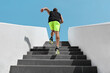 © Maridav - Stairs exercise fitess man running fast up the staircase for hiit cardio workout run at outdoor gym. Sport active athlete lifestyle training legs muscles.
