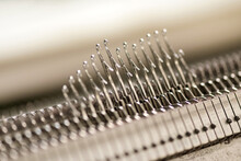 Latch Needles Raised On A Commercial Knitting Machine