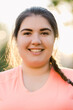 © golubovy - Plus size model. Self acceptance. Body positive. Optimistic lifestyle. Portrait of happy obese young overweight woman smiling outdoors in defocused sunny landscape.