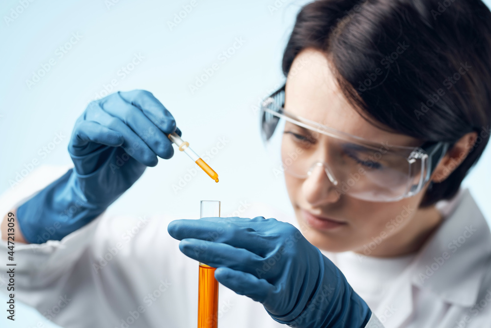 female laboratory assistant in white coat chemical solution test tube science - obrazy, fototapety, plakaty 