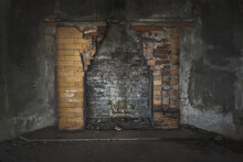 Old Fireplace In A World War 1 Bunker With Damaged Bricks And Weathered Gray Walls
