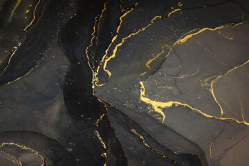 Abstarct fluid ink background with black and golden splashes