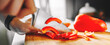© pavel siamionov - Chefs woman hands chopping pepper on wooden board