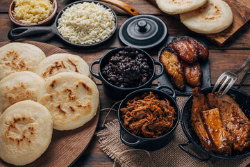 Wall Mural -  Table served with Venezuelan breakfast, arepas with different types of fillings