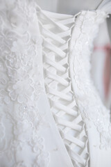 Poster - Close up on wedding dresses at a bridal salon.