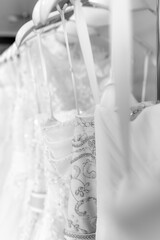 Wall Mural - Close up on wedding dresses at a bridal salon.