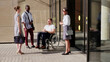 © TommyStockProject - Portrait of disabled businessman and colleagues talking