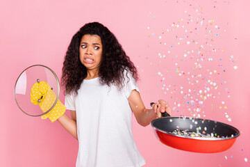 Poster - Photo of scared funny dark skin lady wear white t-shirt having burnt dinner isolated pink color background